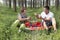 Mother and son had a picnic in the woods.