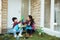 Mother and son highfive while gardening together at home