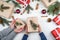 Mother and son holding christmas gifts, top view. Holidays, present, childhood and happiness concept. Child and mother hands