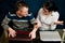 Mother and son with laptops