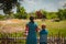 Mother and son looking at elephants in zoo