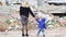 Mother and son near a destroyed house during Russia\'s full-scale invasion of Ukraine