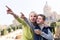 Mother and son paying attention to sight during sightseeing tour