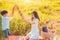 Mother and son play fencing with bread together when picnic at outdoors near lake or river. People lifestyles and Family.