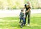 Mother with son at the playground  in face masks. People wears a protective medical masks during an epidemic coronary virus or flu