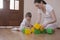 Mother And Son Playing With Cubes At Home