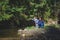 Mother and son playing in the river