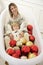 Mother and son posing in a bathtub with Christmas balls