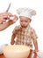 Mother and son preparing cake in the bowl of a blender. White background