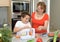 Mother and son preparing lunch in the kitchen. Joking and laughing with a piece of carrot