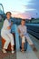 Mother and son sitting on platform of railway