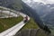 Mother and son sliding down an alpine coaster on vacation laughing