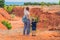 Mother and son travelers in red canyon near Mui Ne, southern Vie