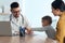 Mother and son visiting pediatrician