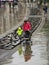 Mother and son walk in Manchester under rain