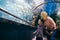 Mother and son watching sea life in oceanarium