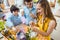 Mother and sons coloring eggs for Easter