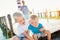 Mother with sons on the pier, lighthouse, sunny summer day