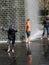 Mother and sons play in Crown Fountain, Millennium Park, Chicago