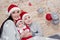 Mother with sons in Santa hats