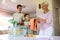 Mother and sons sorting through laundry together at home