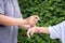 Mother spraying insect repellents on her son arm