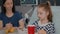 Mother standing with sick girl while eating healthy food breakfast during sickness expertise