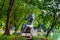 Mother stone Statue carrying baby in park at Bangkok, Thailand