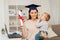 Mother student with baby boy and diploma at home