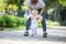 Mother supporting baby daughter and helping her make first steps