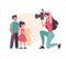 A mother takes pictures of her children. A woman photographs children on a camera with a flash, sister and brother pose