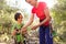 The mother teaches the child to tie a safety knot from the rope