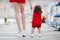 Mother teaches little daughter to walk alone