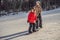 Mother teaches son snowboarding. Activities for children in winter. Children`s winter sport. Lifestyle