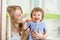 Mother teaching child teeth brushing