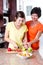 Mother teaching daughter cooking