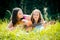 Mother teaching daughter playing guitar