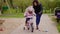 Mother teaching daughter to ride a bicycle