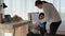 Mother is teaching her daughter to use the spray to clean various devices. Inside the house to be free from germs