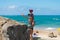 Mother and teen son taking a selfie by the beach in Itapua