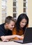 Mother and teenage boy with laptop