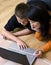 Mother and teenage boy with laptop