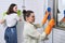 Mother and teenage daughter cleaning together in bathroom