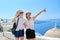 Mother and teenage daughter traveling together, luxury travel, island Santorini