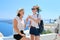 Mother and teenage daughter traveling together, luxury travel, island Santorini