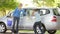 Mother And Teenage Daughter Washing Car Together