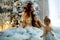 Mother and three daughters at Christmas in beautiful outfits