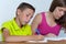 Mother and tween child doing homework together