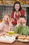 Mother and two children at Halloween in kitchen