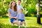 Mother with two children summer outdoors